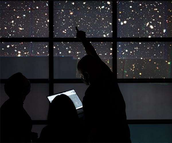 Wide view of early universe hints at galaxy among the earliest ever detected