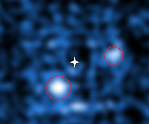 Pair of Fledgling Planets Seen Growing Around Young Star
