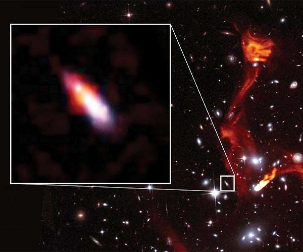 Cosmic lens reveals faint radio galaxy