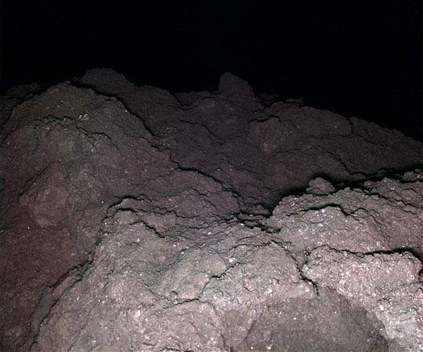 RNA base in asteroid samples suggests origins of life on Earth