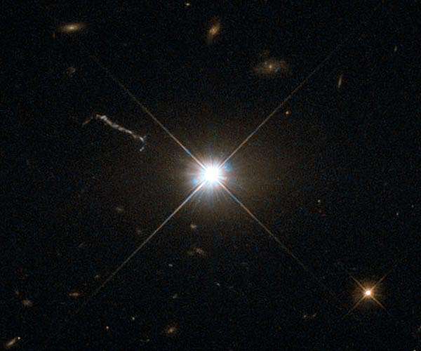 Gas Clouds Whirling Around Black Hole in Distant Quasar
