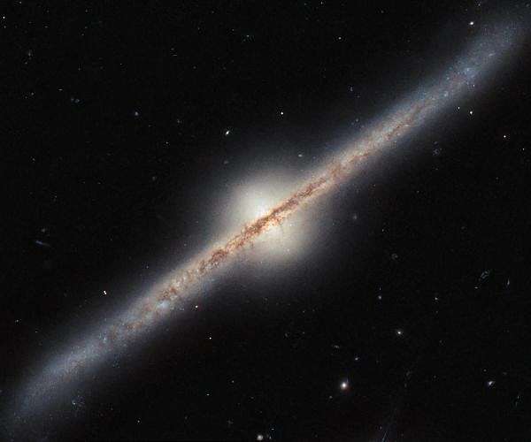 Hubble reveals stunning edge-on view of spiral galaxy