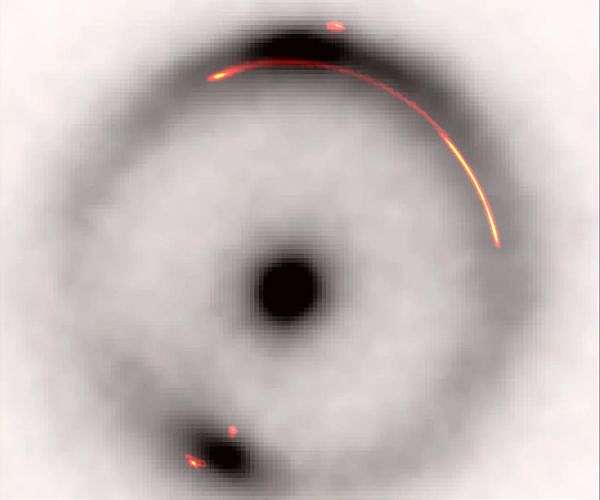 Astronomers detect unseen dark mass shaping distant galaxy light