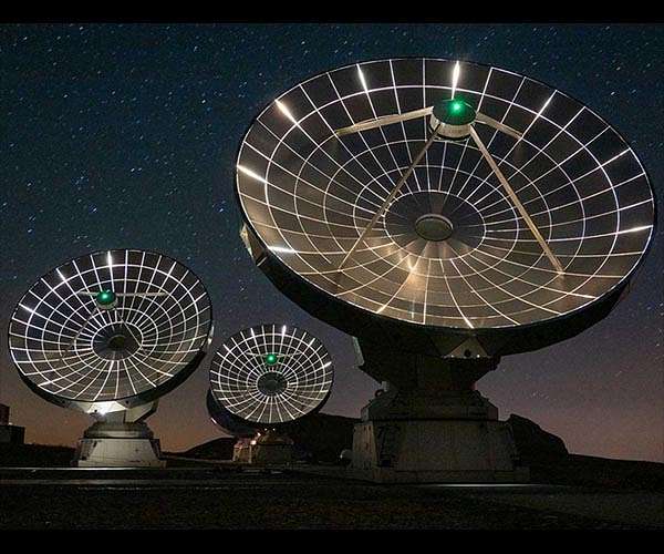 Shadow of cosmic water cloud reveals the temperature of the young Universe