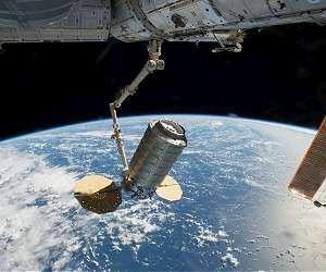 Spacewalkers fix robotic arm in time to grab next cargo ship
