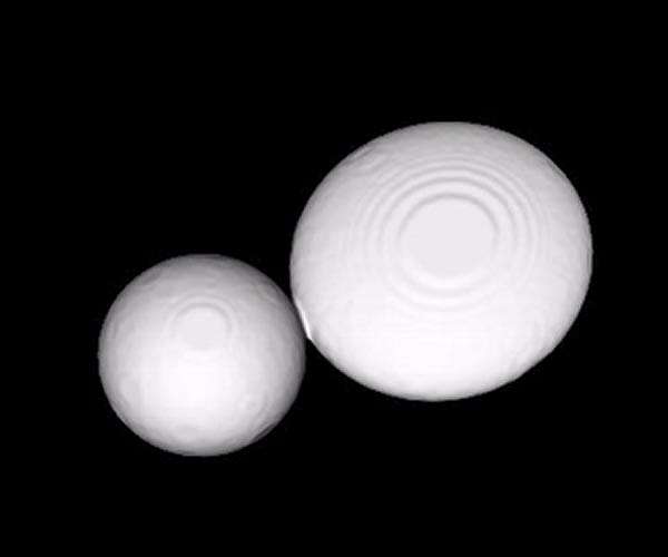 The birth of a "Snowman" at the edge of the Solar System