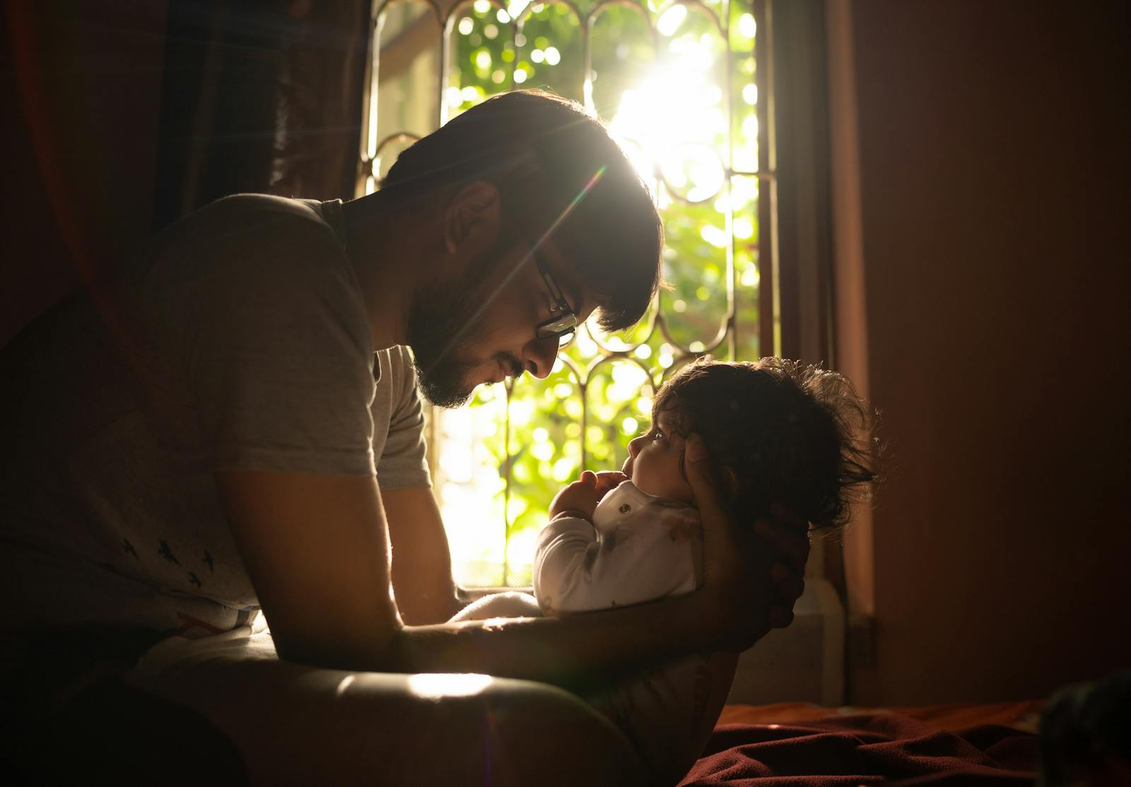father holding small child