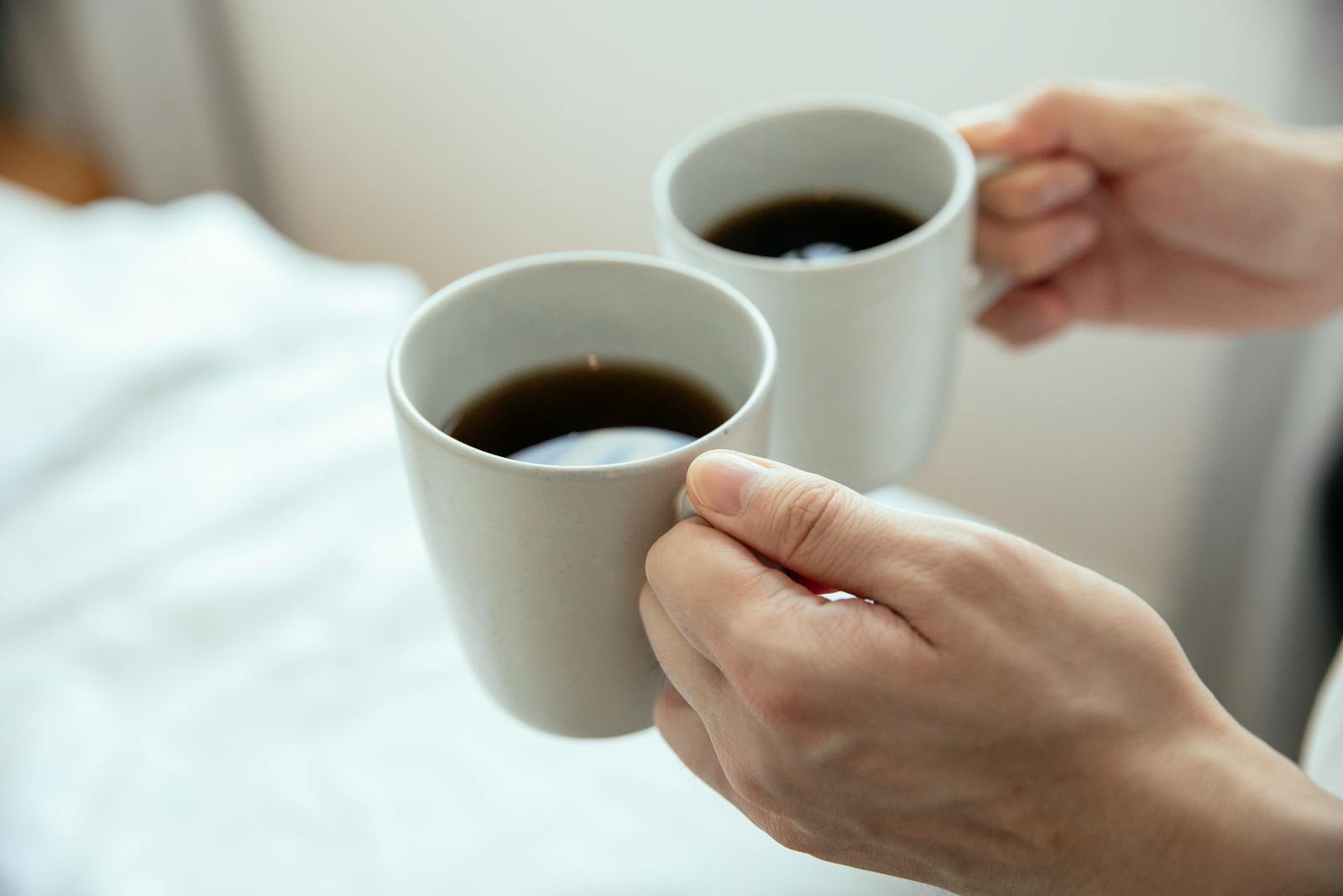 hands holding warm coffee