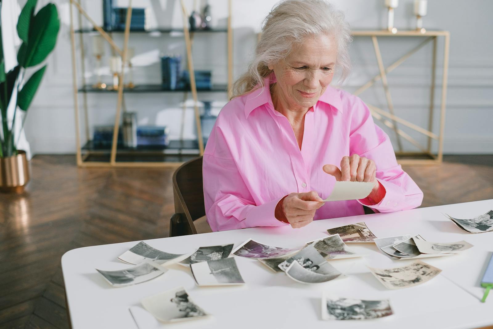 person looking at old photographs