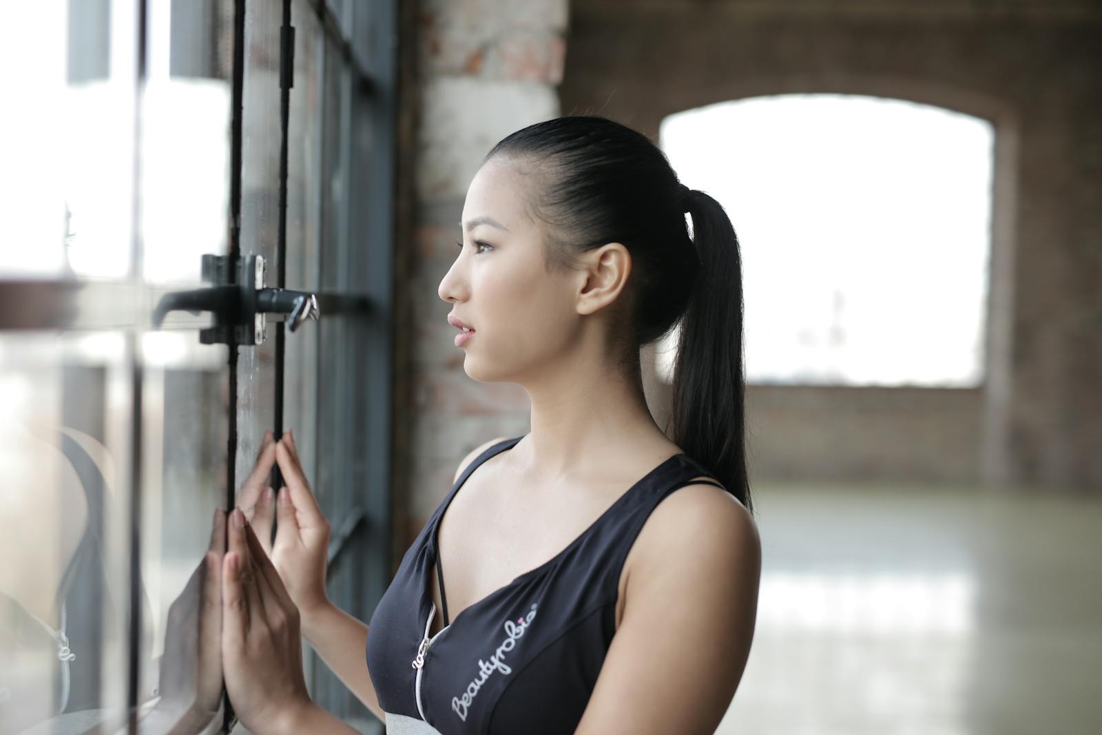 woman looking out window