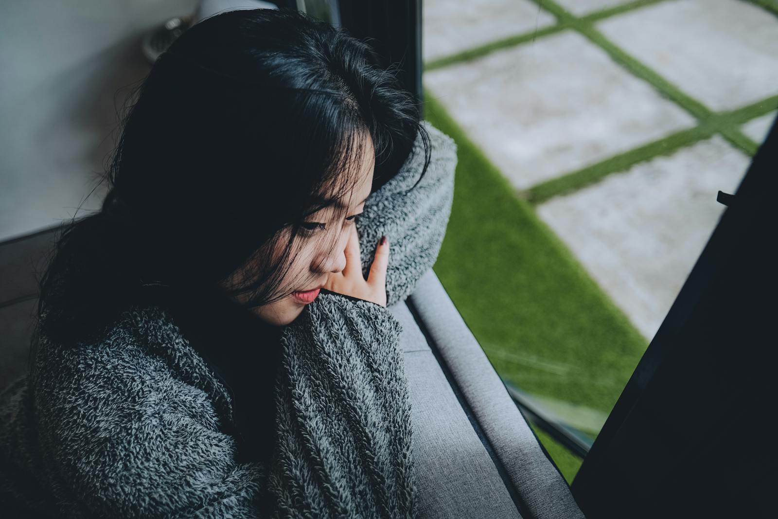 woman looking out window