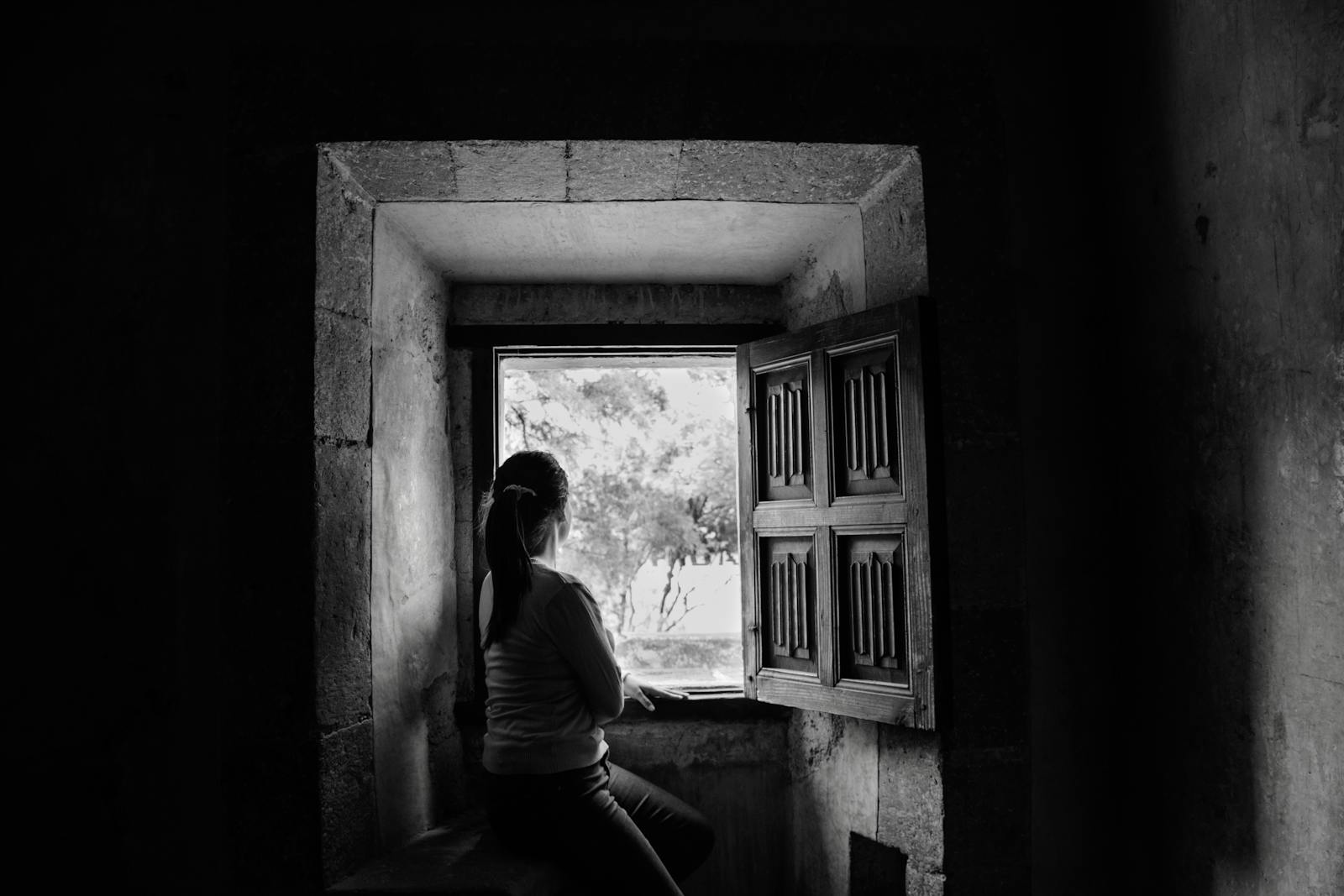 woman thinking by window