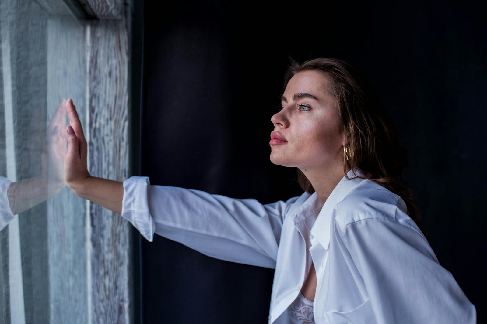 woman thinking window light