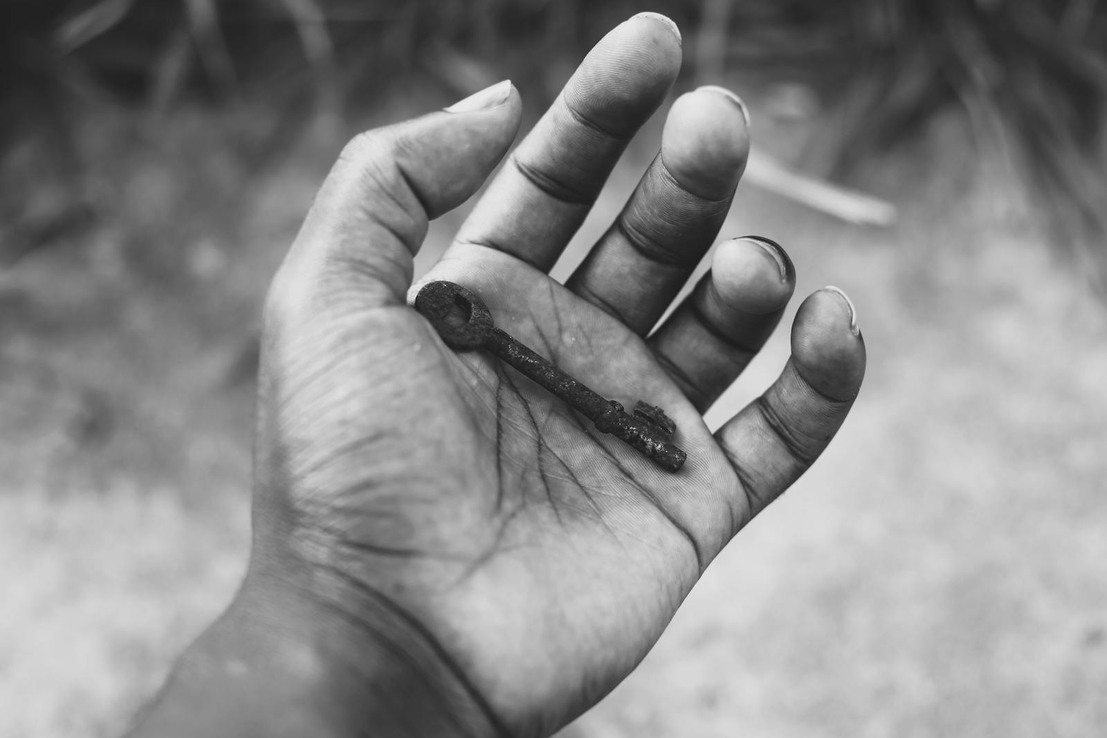 hands holding old keys