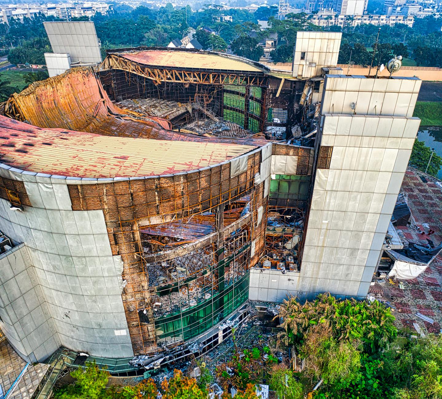 An aerial shot of a decaying and partially collapsed building in Banten, Indonesia.