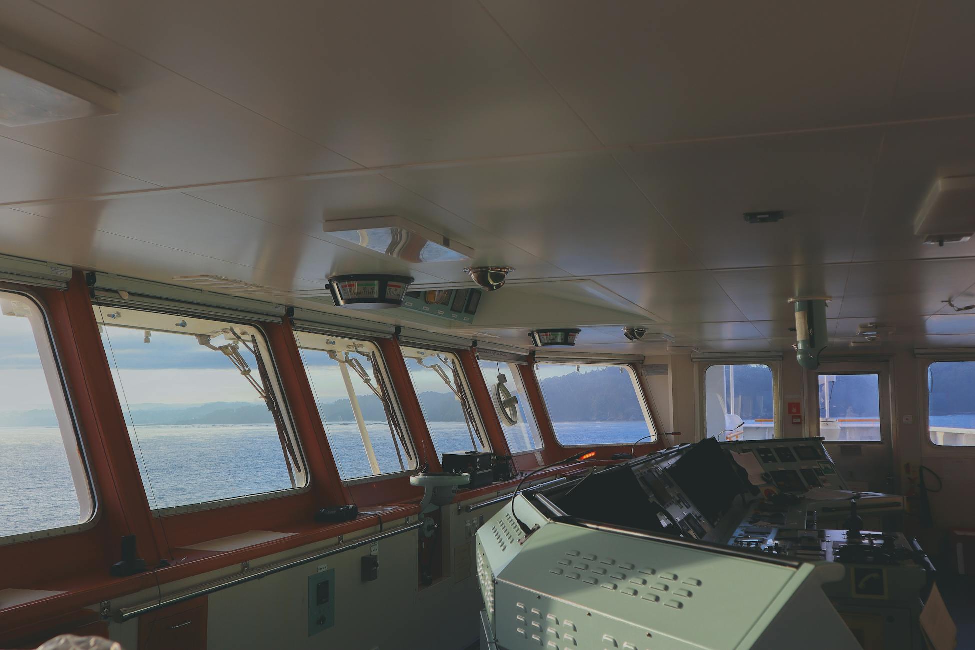 Interior view of a ship's bridge with panoramic sea view in Spain.
