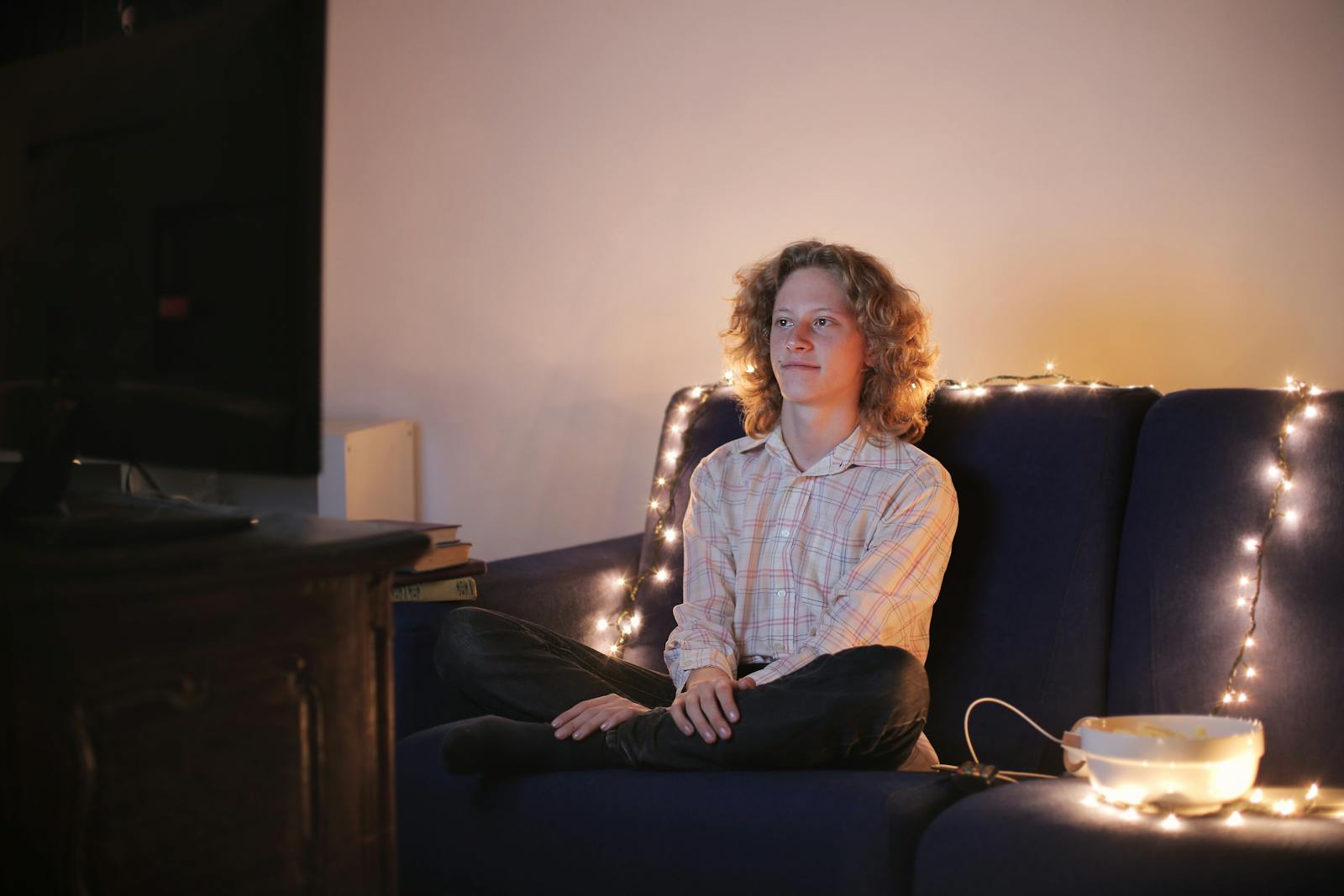 man watching tv evening