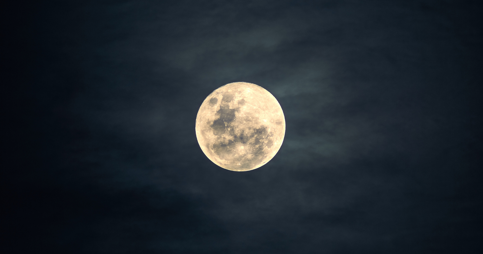 The leading explanation for how the Moon was born is that a world the size of Mars called Theia slammed into the young Earth and flung out the debris that became the Moon, and recent research suggests Theia itself never fully left, with two continent-sized blobs buried near our planet's core possibly being the last remains of the world that struck us.