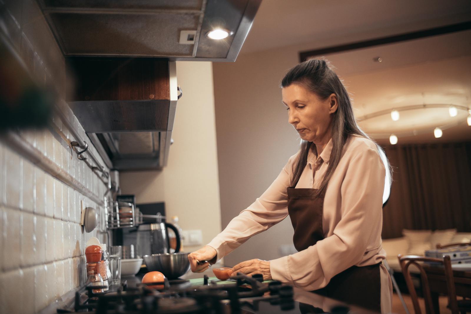 older woman kitchen evening