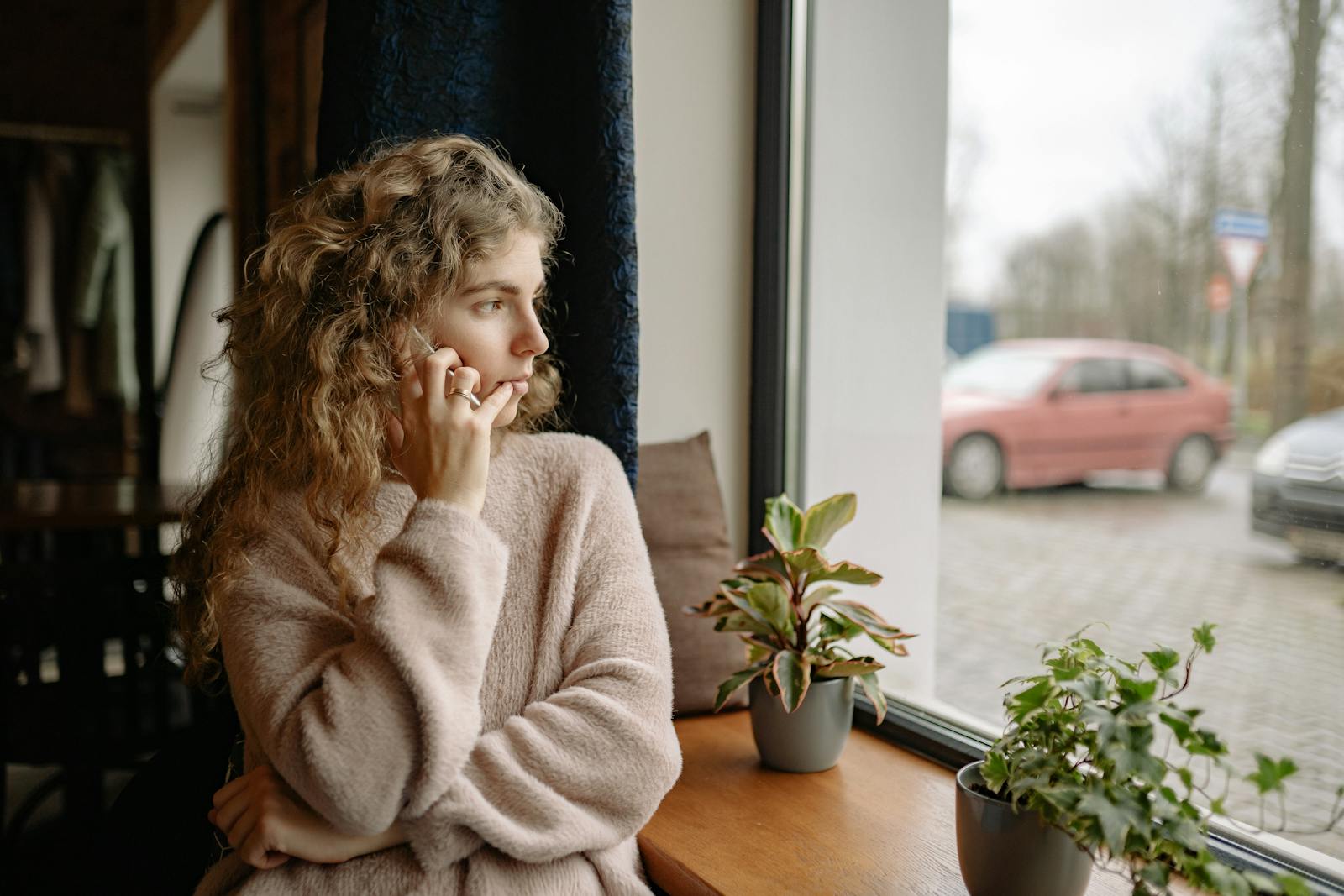 older woman looking out window