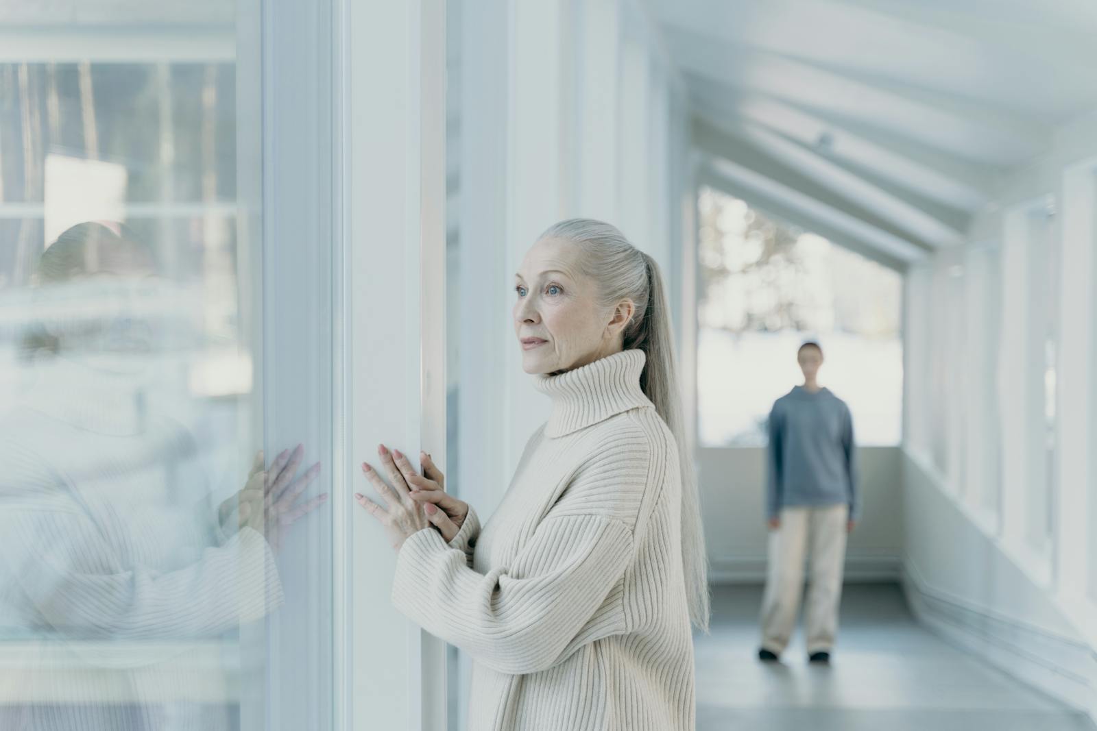 older woman thinking window