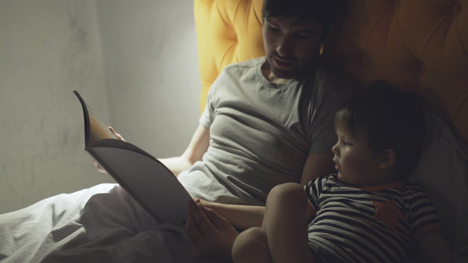 parent child holding documents