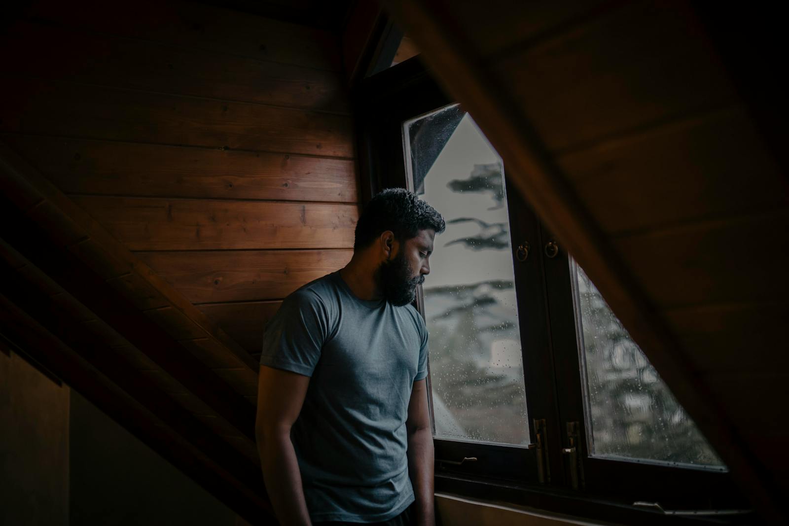 person quiet thoughtful window