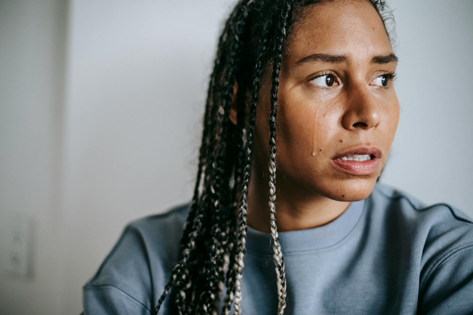 Psychology says adults who cry at commercials, songs from their twenties, and strangers being kind to each other in public aren't overly sensitive, they may have spent decades holding back tears that had nowhere acceptable to go