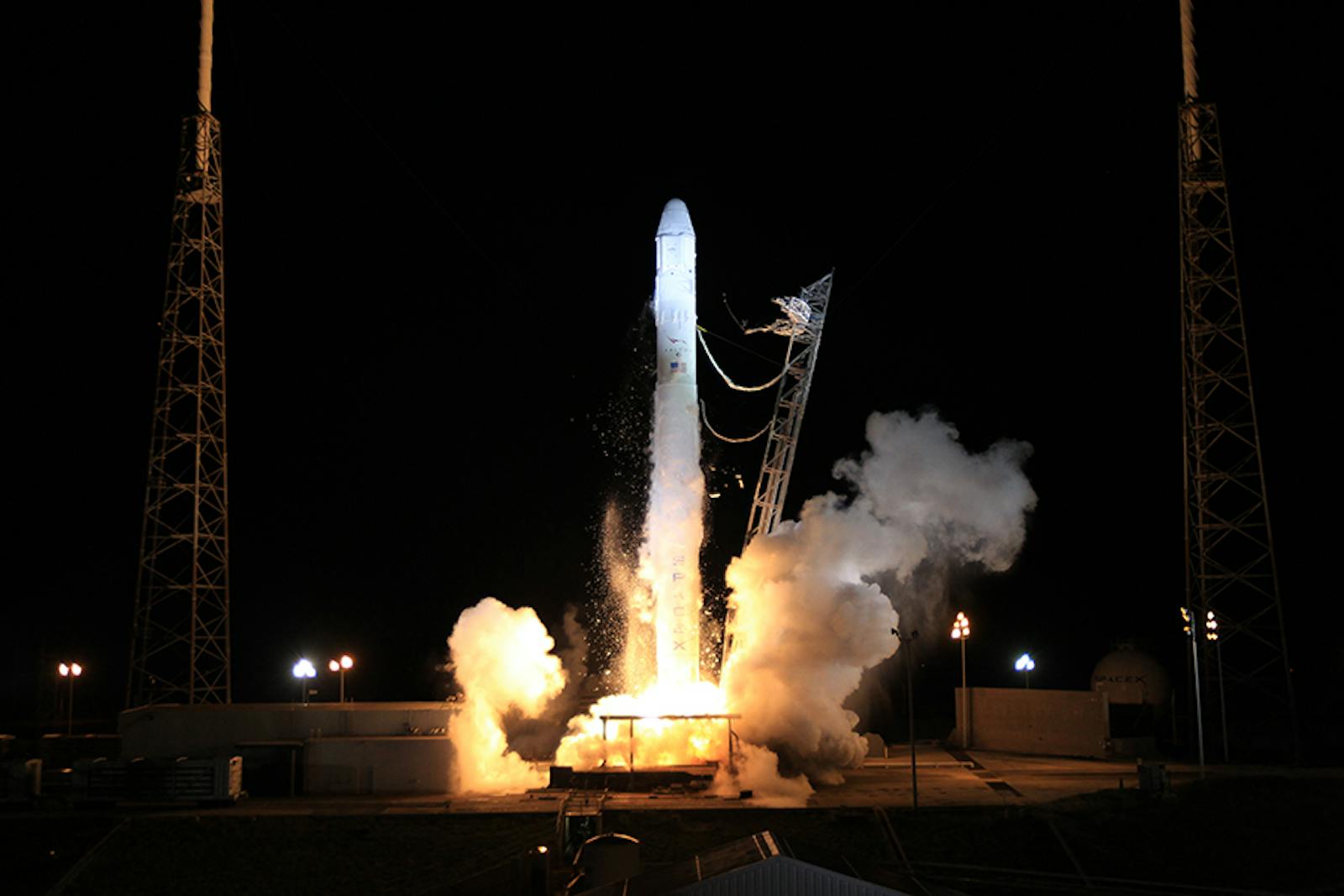 SpaceX is reflying its sixth cargo Dragon while Boeing's crewed Starliner reverts to uncrewed resupply — and the $4.2B-versus-$2.6B contracts that produced both were signed the same day in 2014