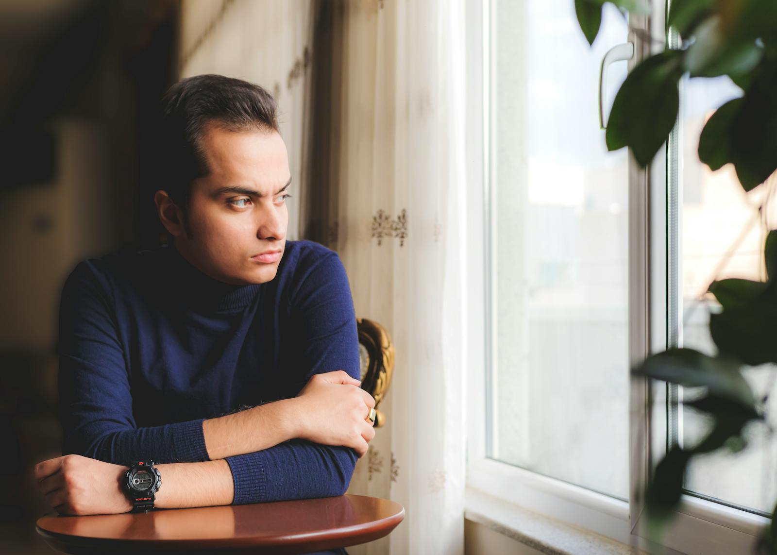 thoughtful person at window