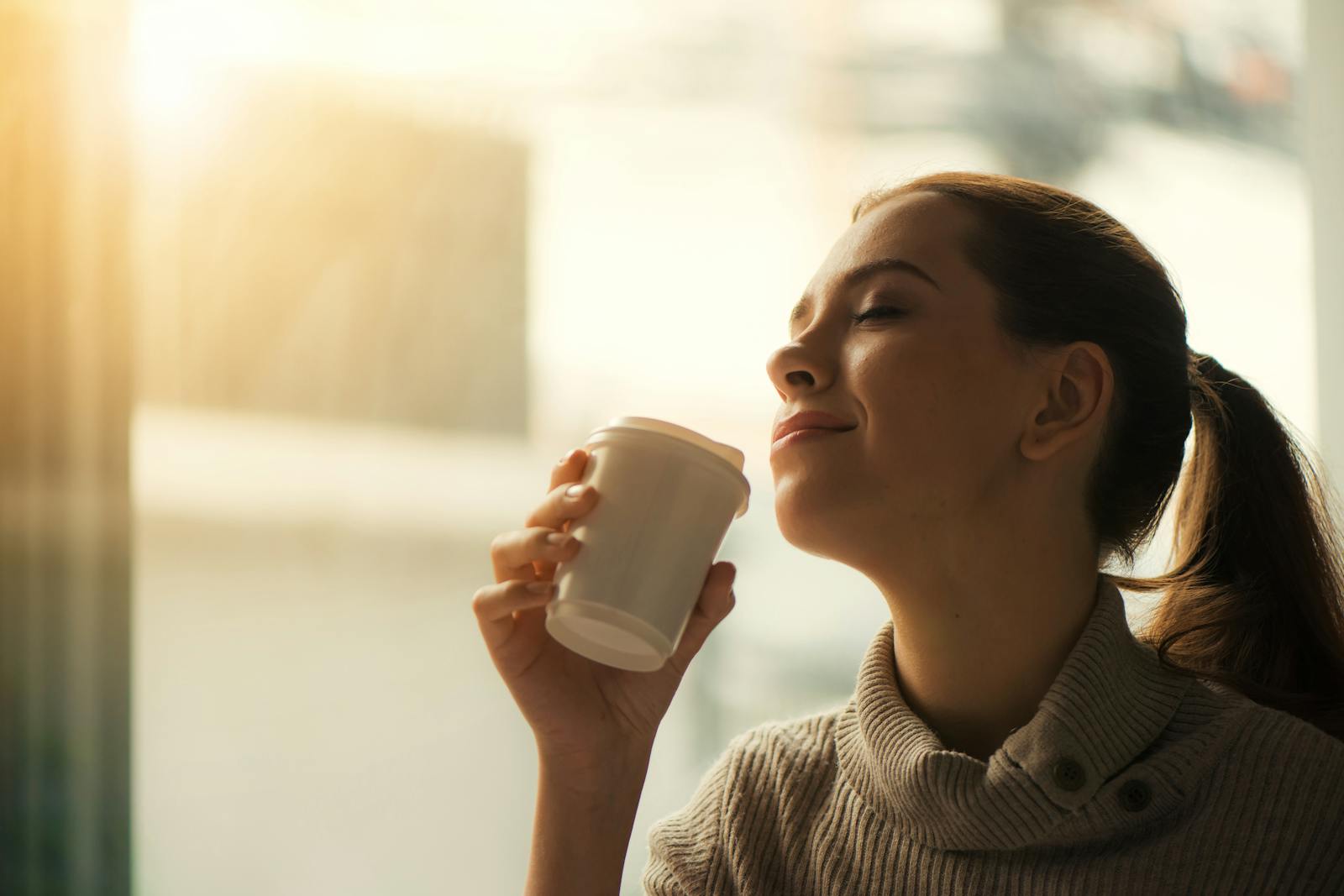 tired woman coffee window