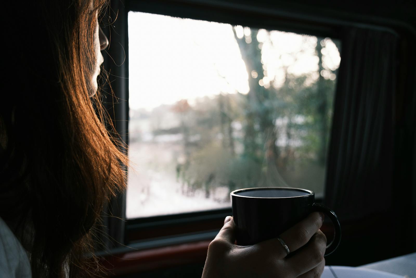 woman alone at window