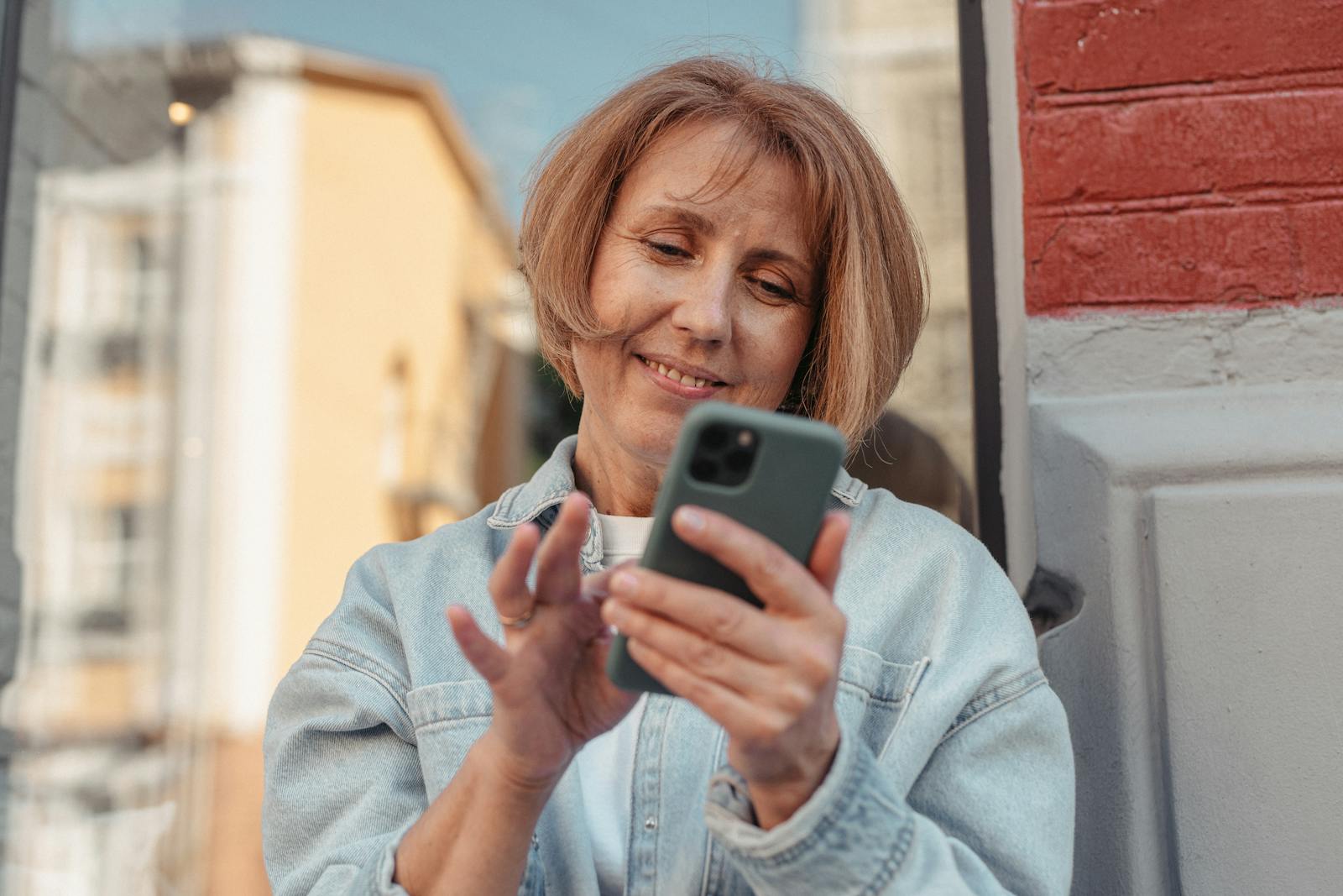 woman checking phone relieved