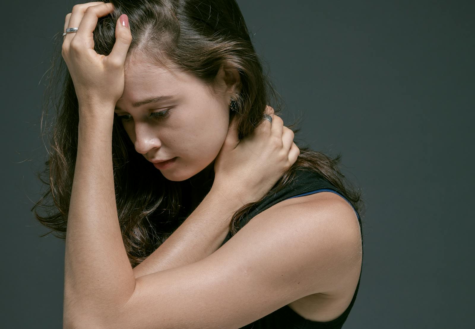 woman looking down apologetic