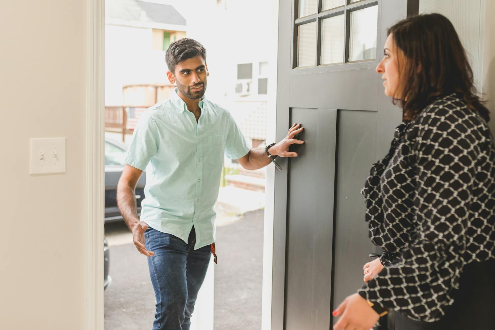 woman opening front door