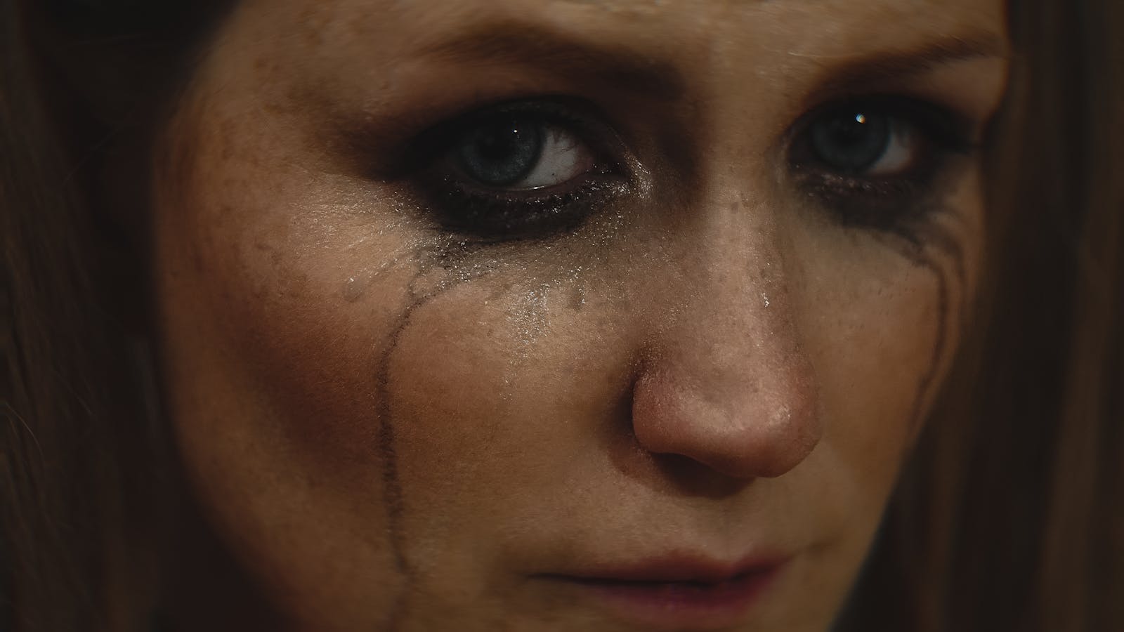 woman wiping tears