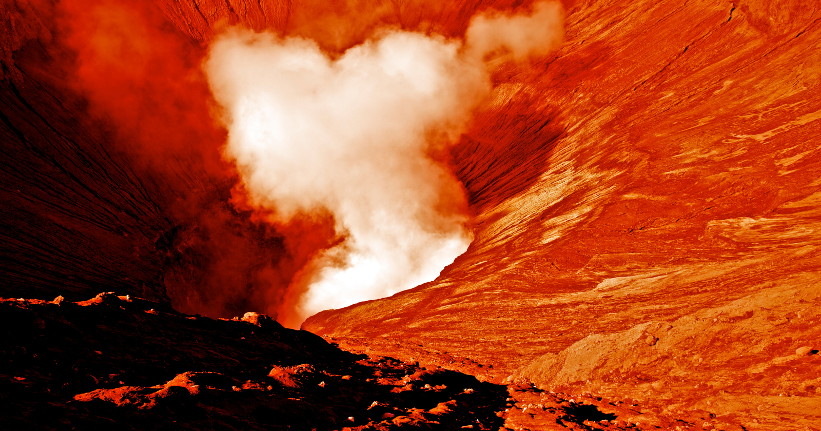 The largest known volcano in the solar system is on Mars — Olympus Mons, a mountain so vast that its base would cover the entire state of Arizona, with a peak rising nearly 22 kilometers above the surrounding plain, almost three times the height of Mount Everest — and it is gentle enough in slope that an astronaut walking up its flank might not realize they were climbing a mountain at all