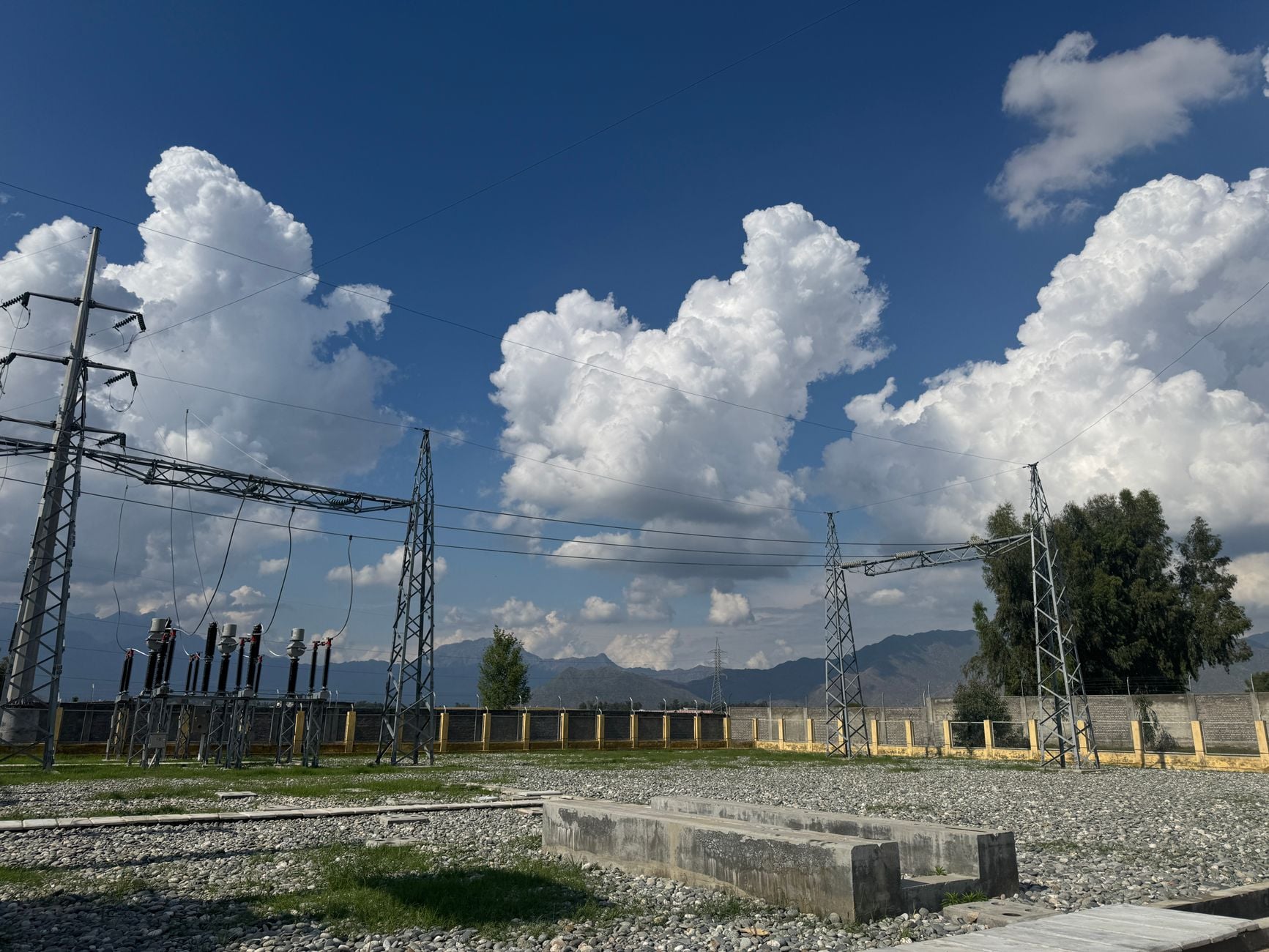 Stunning view of power lines against dramatic clouds in Rustam, Pakistan.