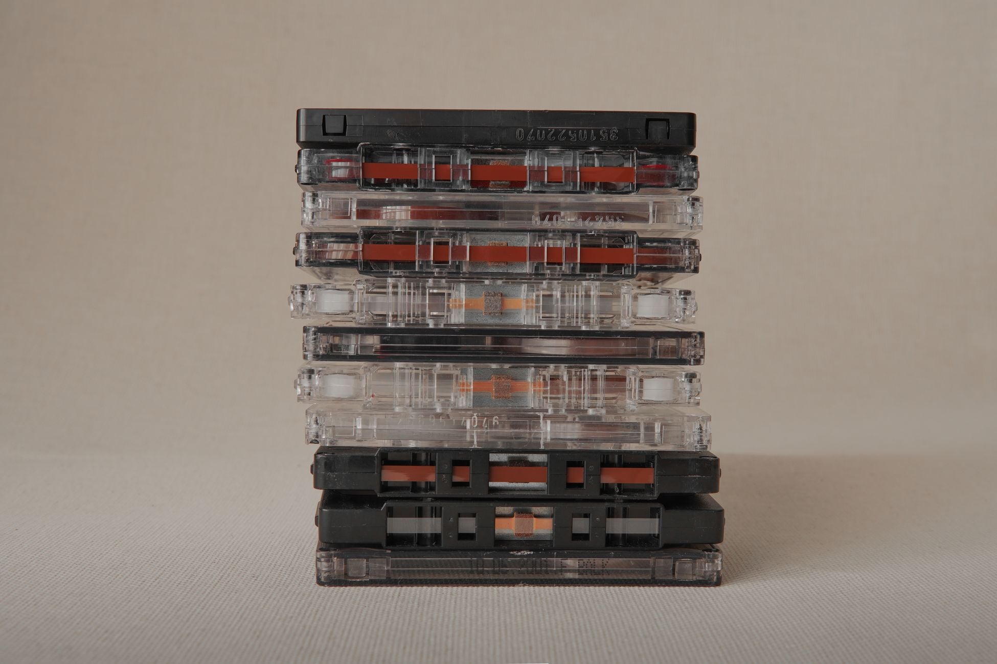 A stack of classic cassette tapes, showcasing retro music media. Perfect for nostalgia-themed projects.
