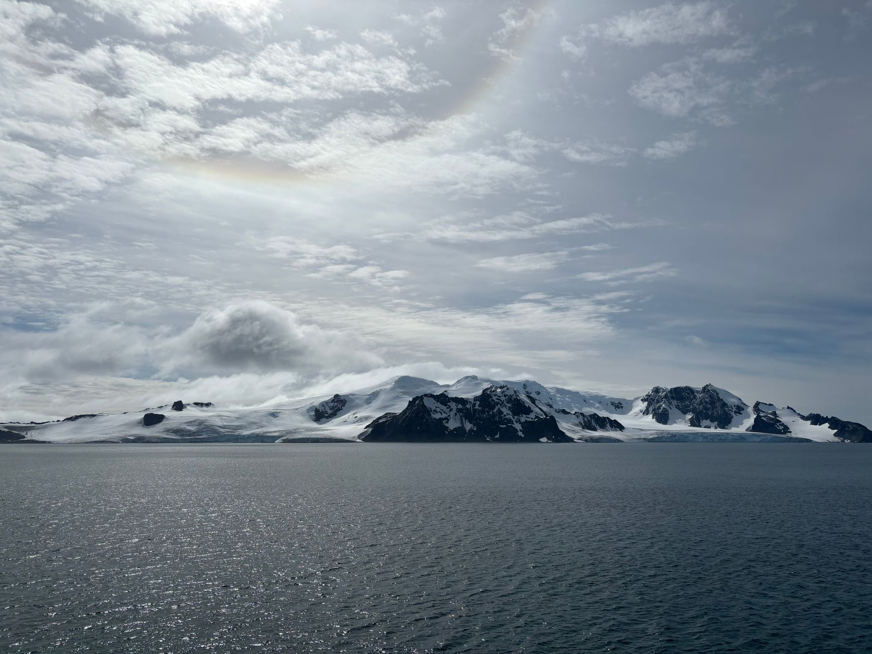 Breathtaking view of Antarctic glaciers and ocean under cloudy sky. Perfect for nature and travel themes.
