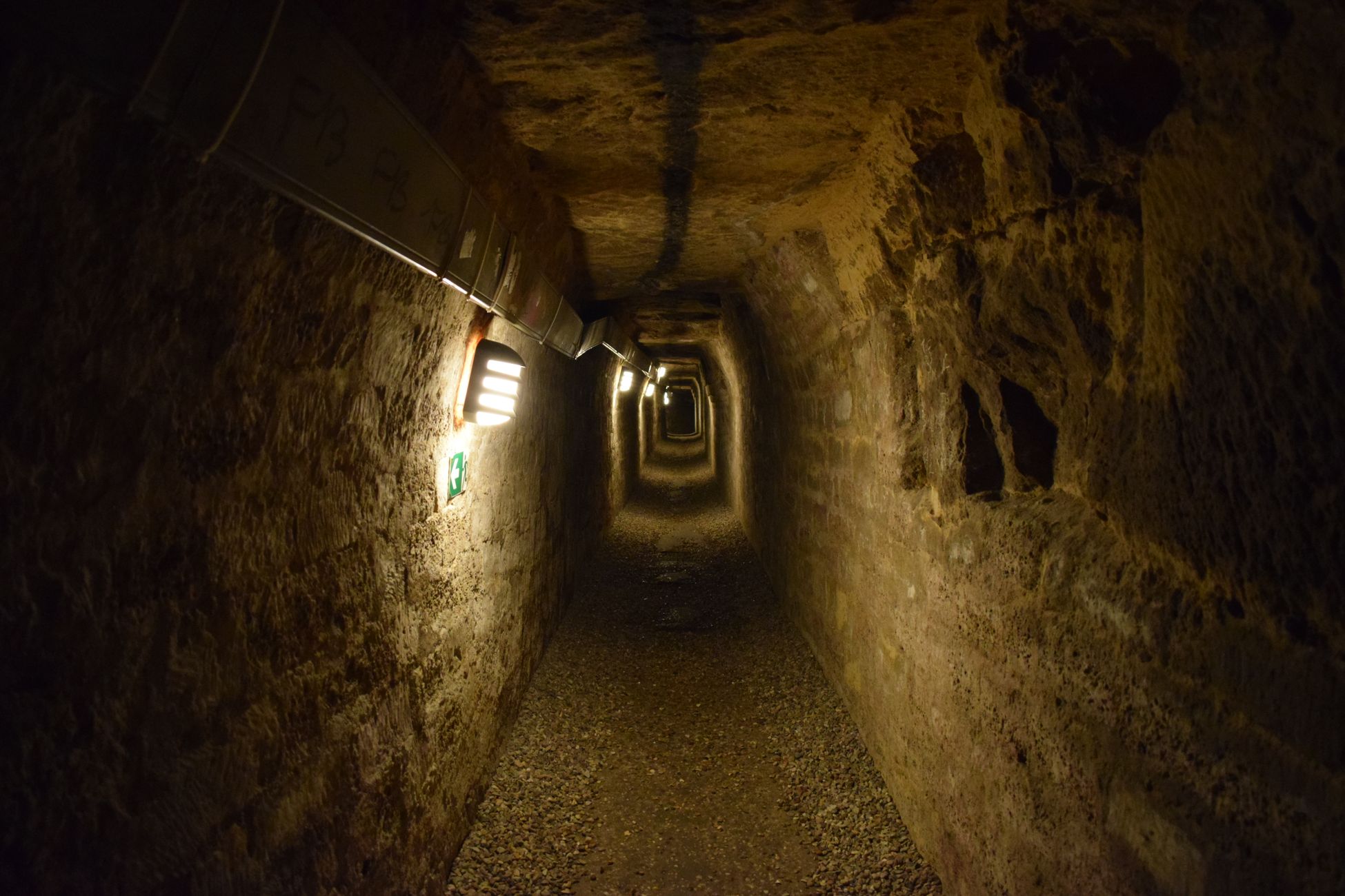 Beneath the streets of Naples lies a 2,400-year-old network of Greek and Roman tunnels and cisterns carved into soft volcanic tuff, and during World War II tens of thousands of residents sheltered in the same hollow chambers their ancestors had dug to quarry building stone.