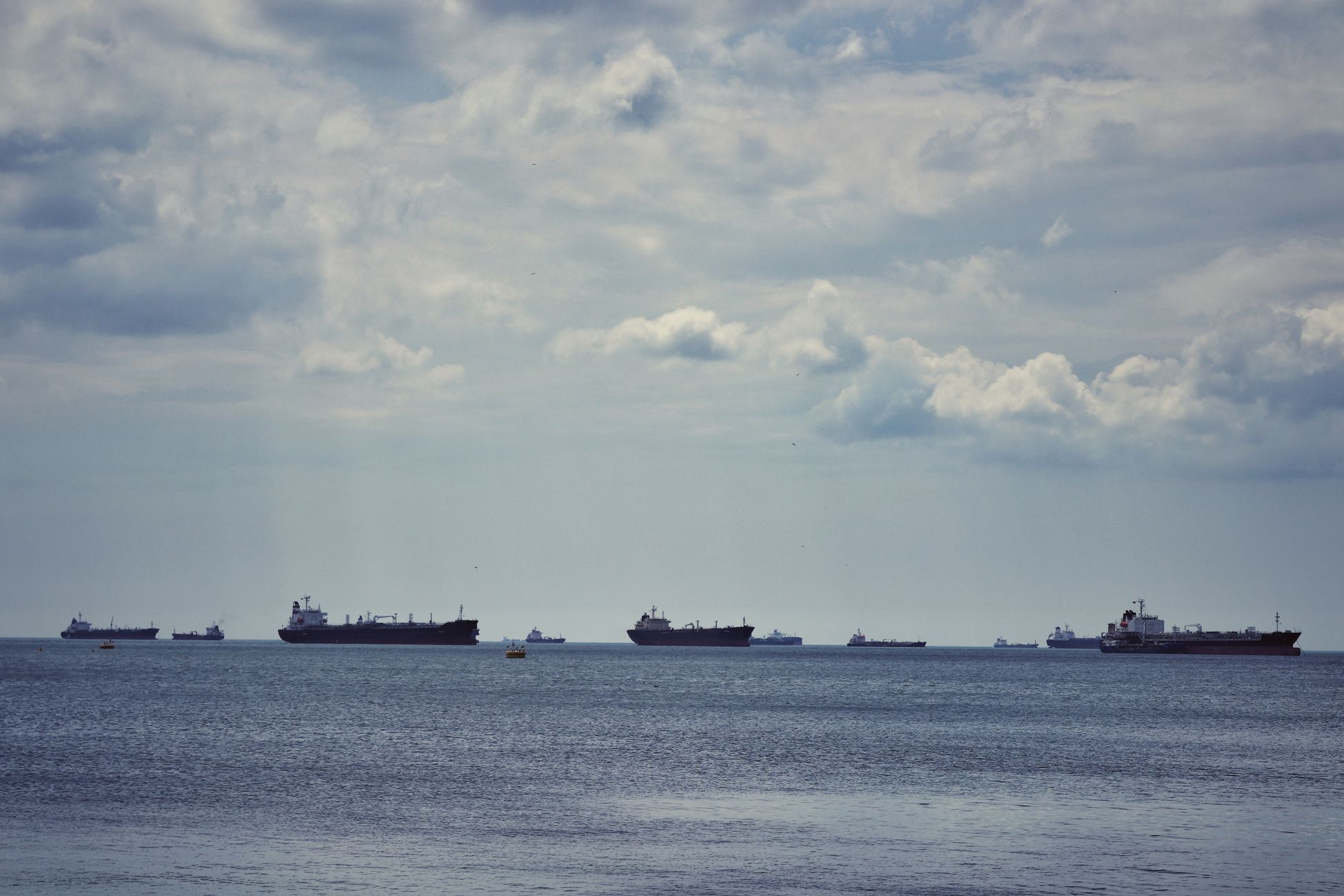 The Singapore Strait funnels roughly a third of the world's traded goods through a channel narrowing to about 3 kilometres wide near Phillip Channel, making it one of the busiest and most pirate-prone waterways on Earth, where ships sometimes queue for days awaiting passage