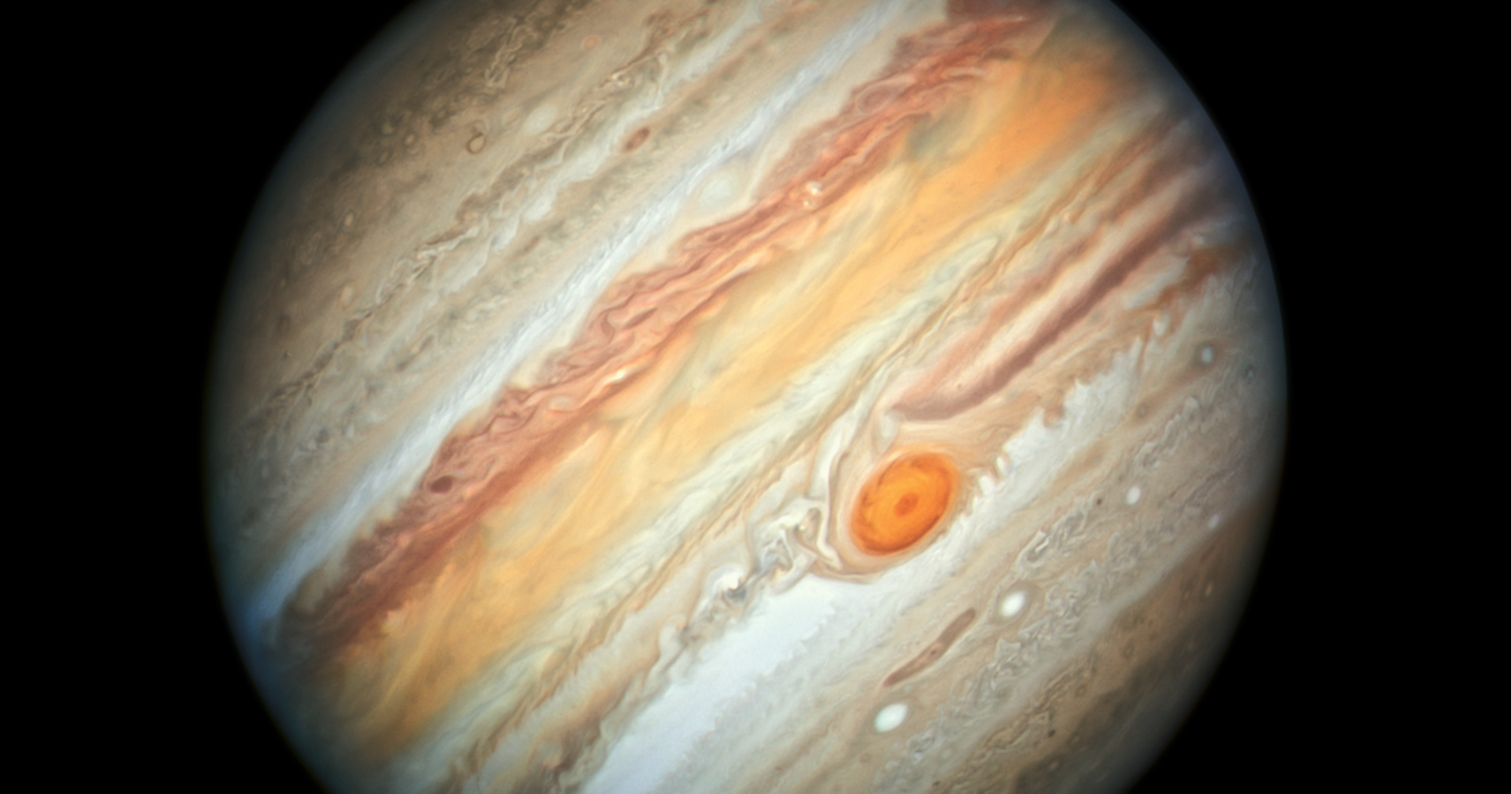Jupiter’s Great Red Spot is a storm wider than Earth that has raged for at least 150 years. Once large enough to swallow several Earths, it has been shrinking for more than a century, and astronomers can now track its changing size decade by decade.