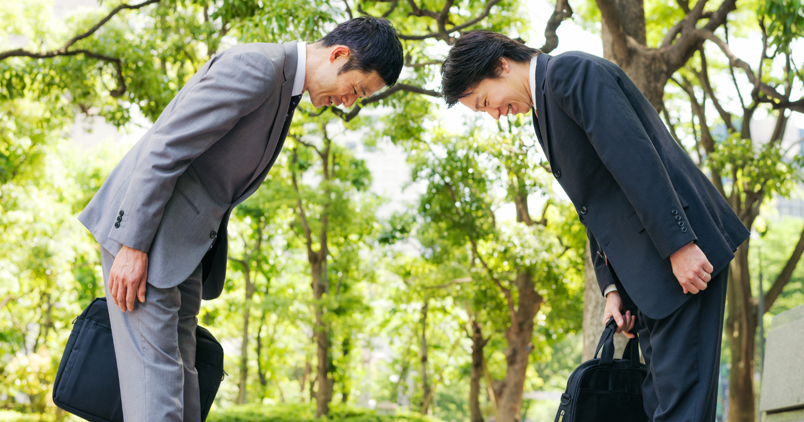 In Japan, the depth of a bow carries specific institutional meaning — a 15-degree bow is a casual greeting between colleagues, a 30-degree bow is a formal greeting to a client or customer, and a 45-degree bow is reserved for serious apology, gratitude, or the greeting of someone whose social standing significantly exceeds your own