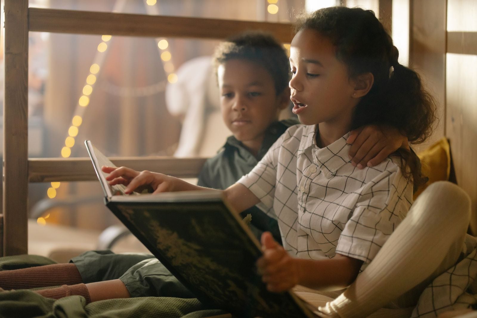 children reading paper books