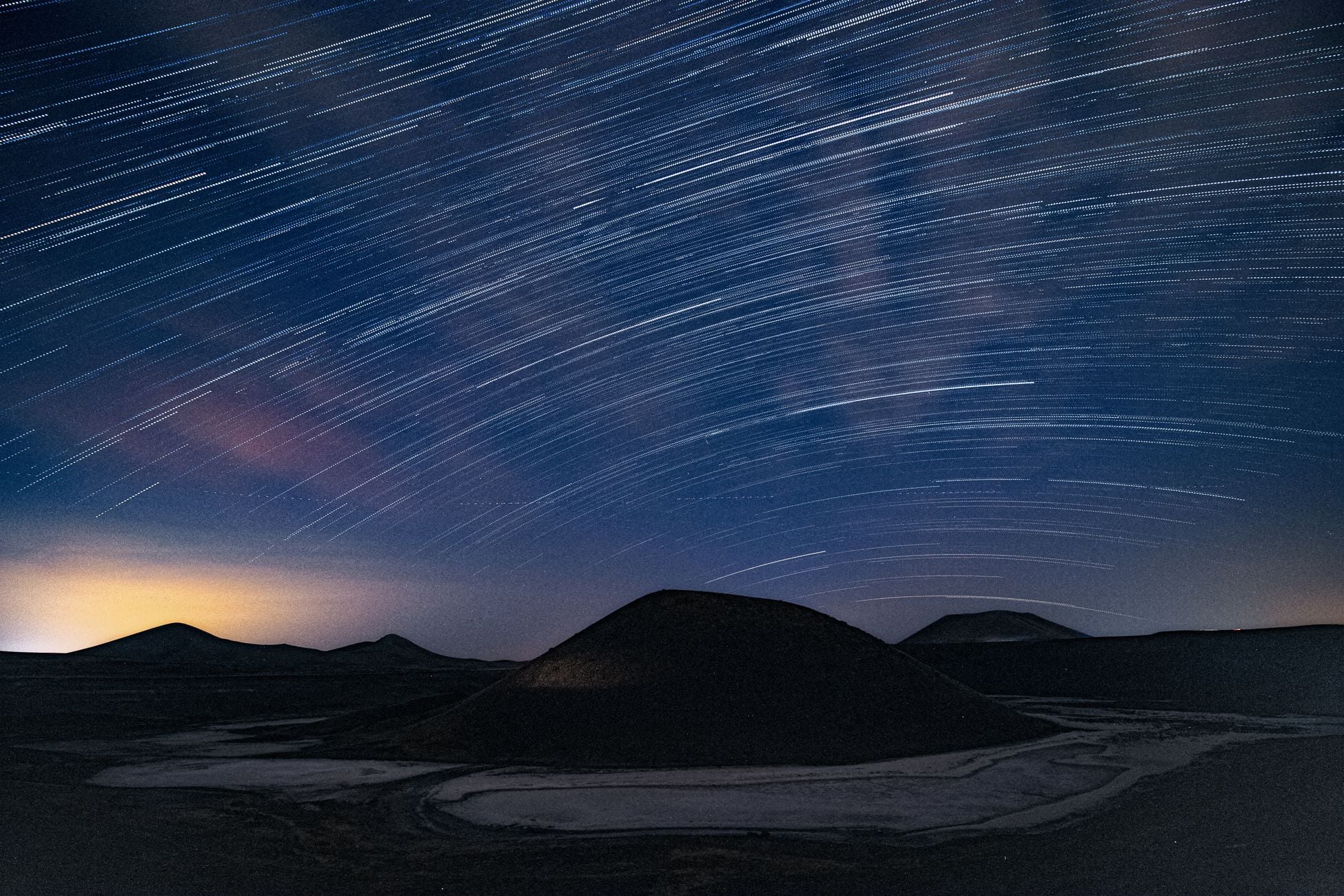 Capture the beauty of sweeping star trails over Turkey's unique terrain at night.