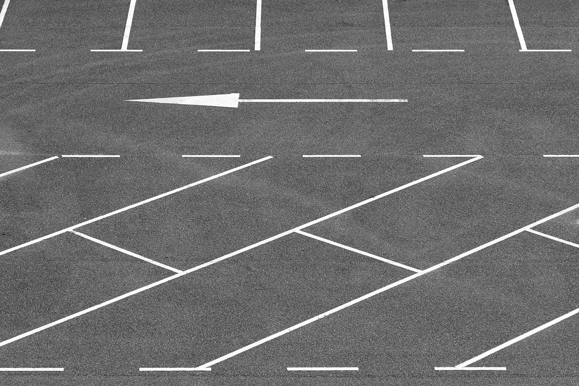 An empty parking lot at night.