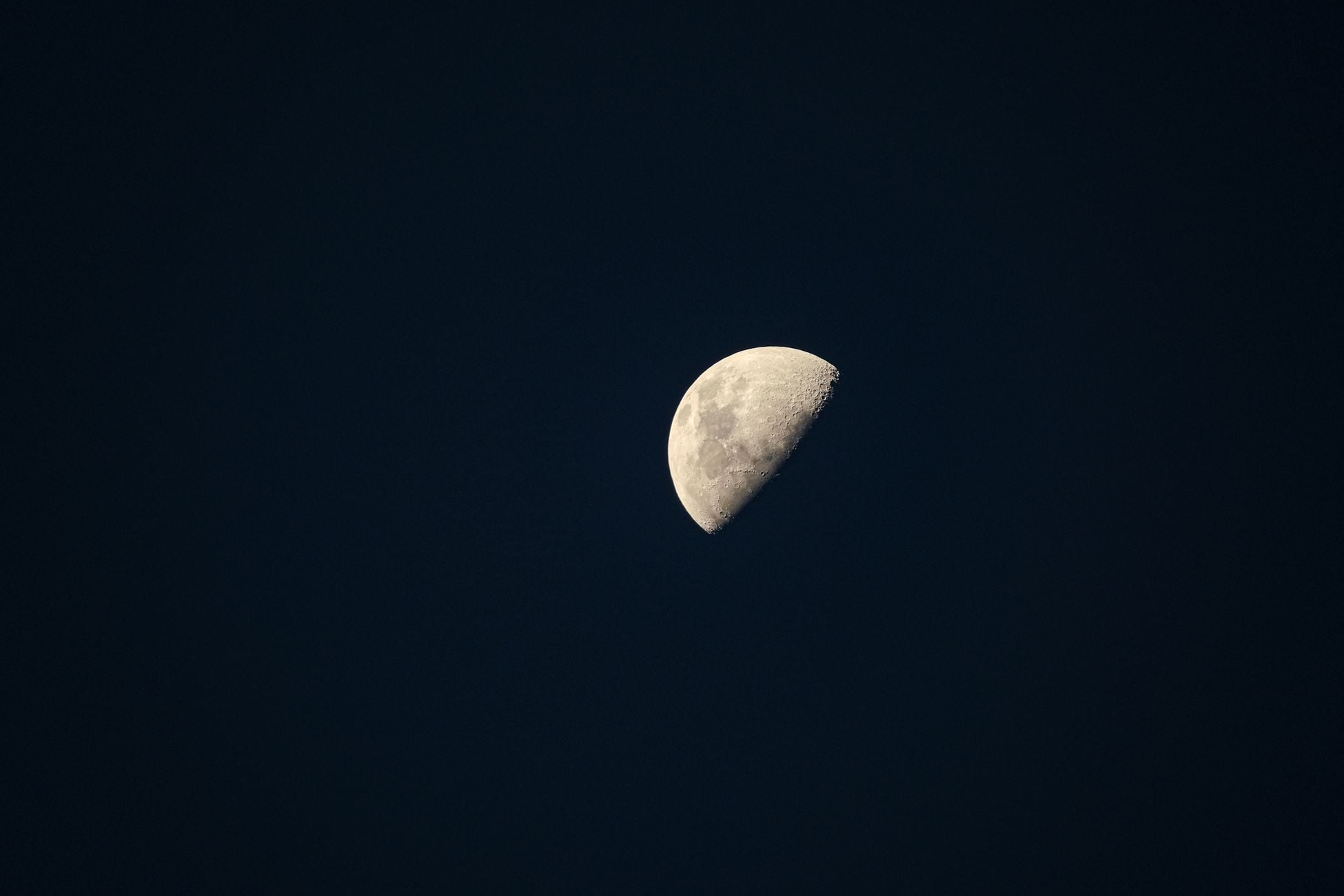 Captivating crescent moon against a deep night sky, showcasing lunar details.