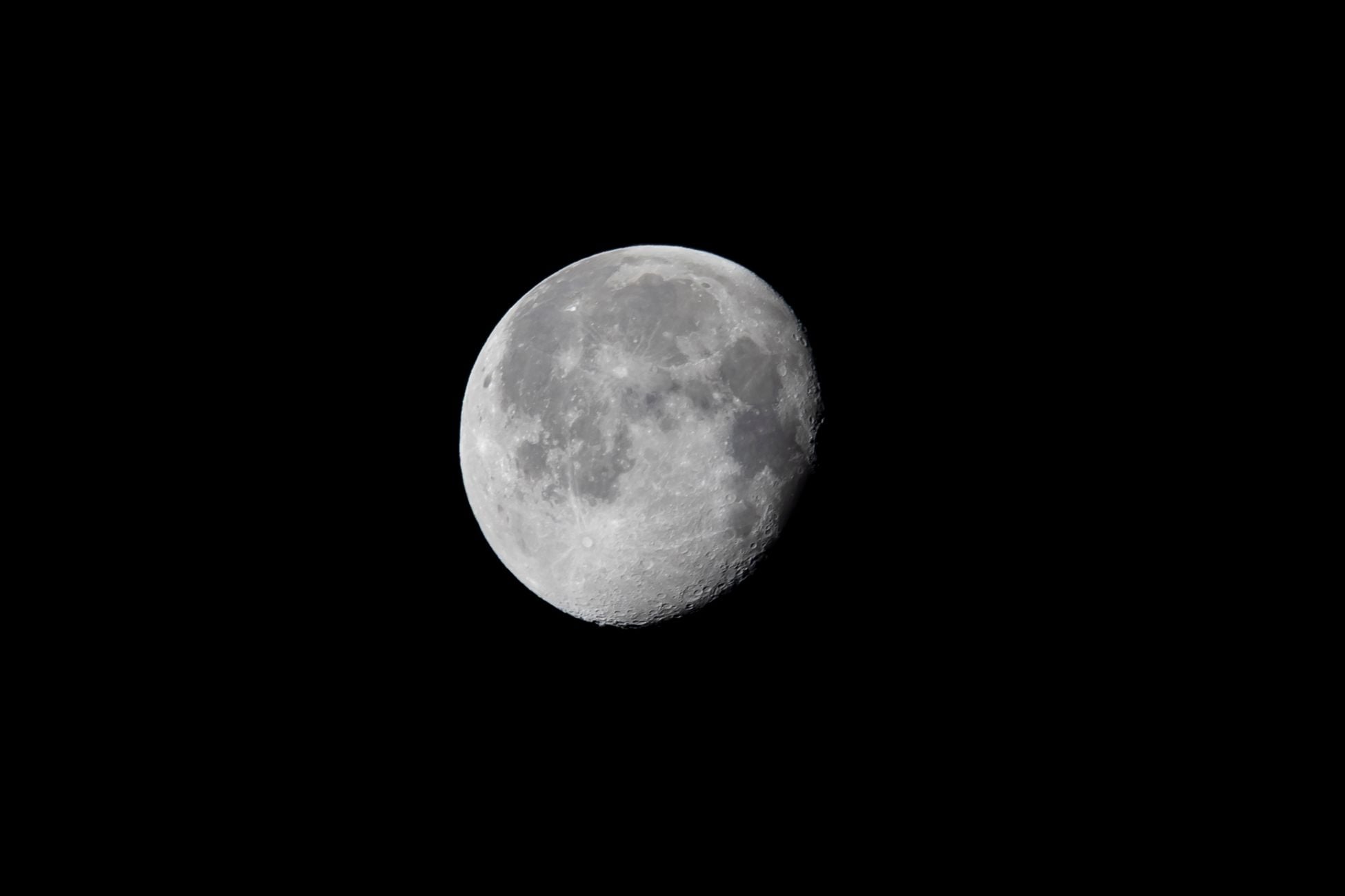 The moon is drifting away from Earth by about 3.8 centimetres a year — measured to the millimetre by bouncing laser light off mirrors the Apollo astronauts left sitting in the lunar dust more than half a century ago