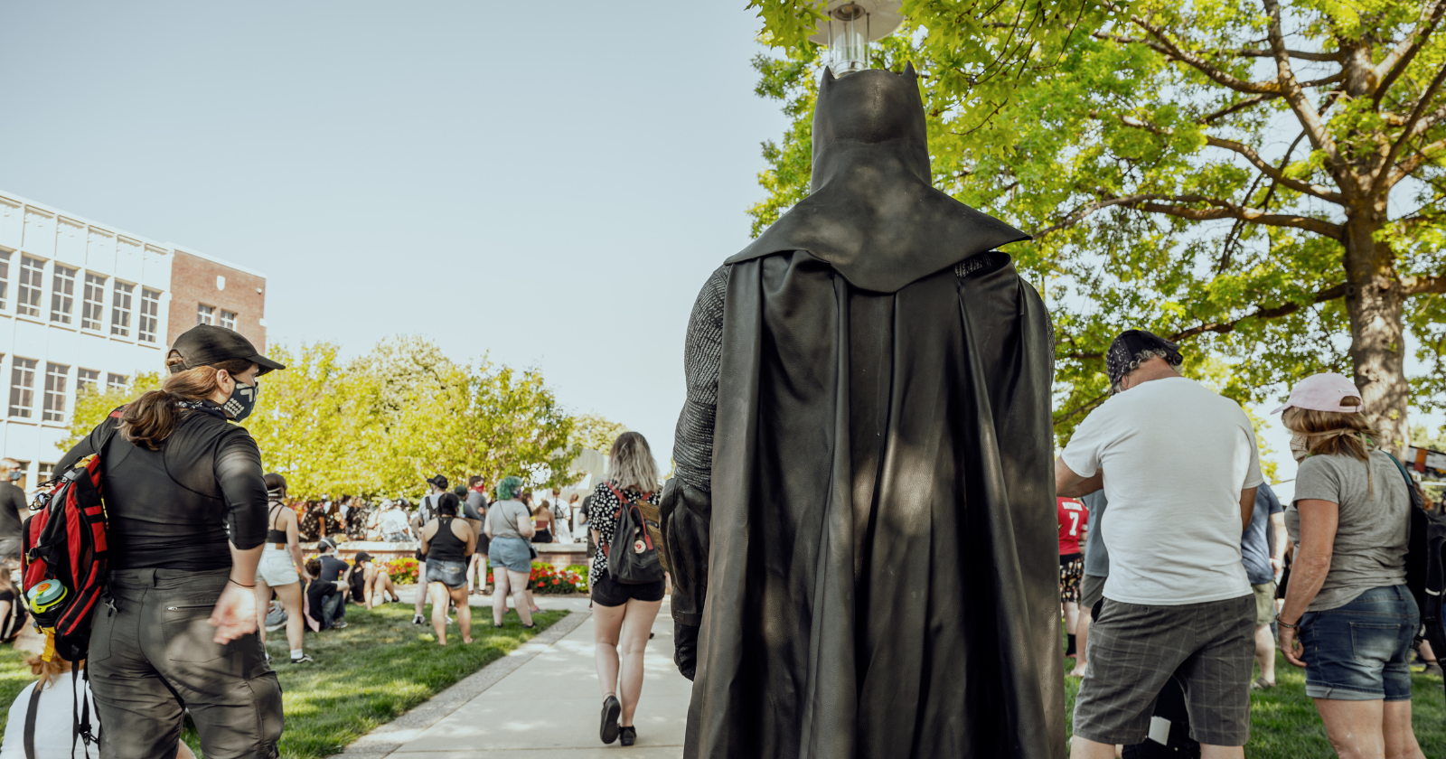 A man in a Batman costume stood silently on a Milan train, a few metres from a woman who appeared pregnant, and never once interacted with her or anyone else — yet his presence alone was followed by a jump in the share of passengers who offered her a seat from roughly one in three to two in three